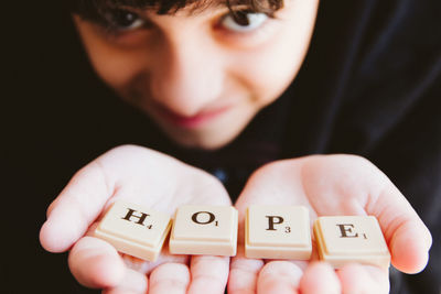 Close-up of boy with text