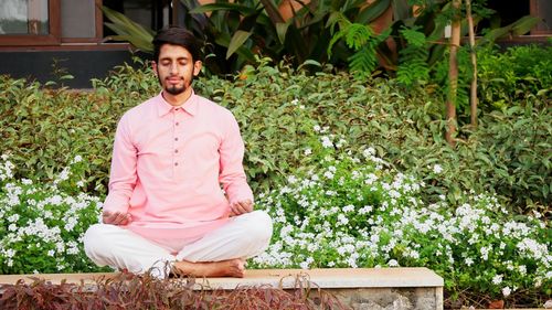 Portrait of young man sitting outdoors