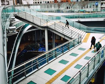 High angle view of people walking on bridge