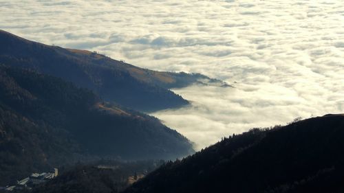 High angle view of mountains and clouds