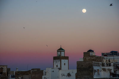 View of buildings against sky at sunset