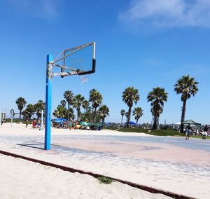 View of basketball hoop against blue sky