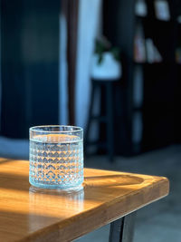 Close-up glass with fresh mineral water on table