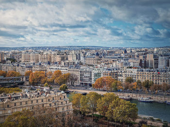Paris cityscape over the seine river, view from the eiffel tower height, france. fall season scene 
