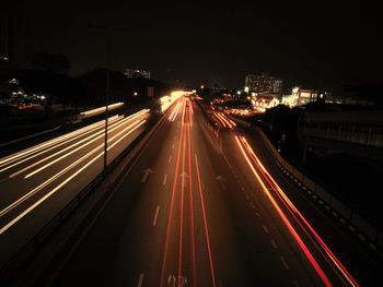 High angle view of light trails on road at night