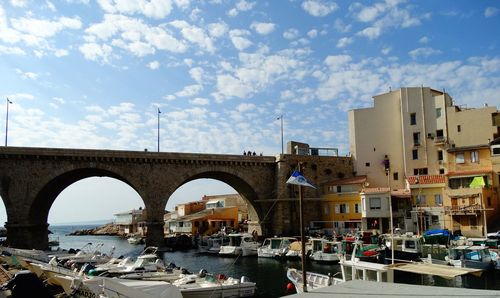 View of bridge against cloudy sky