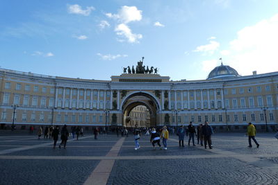 Group of people in front of historical building
