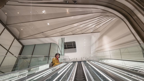 Low angle view of woman on the spiral staircase