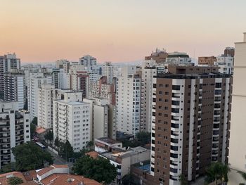 High angle view of buildings against sky during sunset