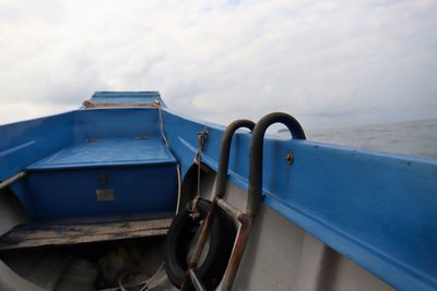 Close-up of boat moored on beach