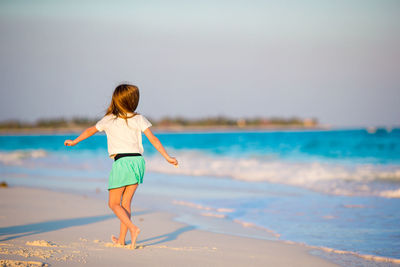 Rear view of woman on beach