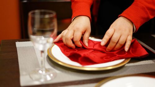 Midsection of man preparing food in restaurant