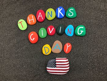 Multi colored text on stones at road