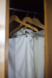 Close-up of clothes hanging on clothesline at home