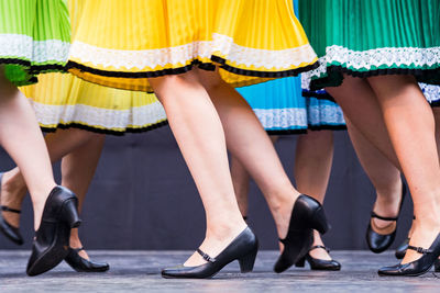 Low section of women standing in shoes