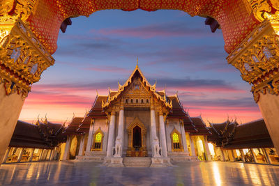 Temple against sky during sunset