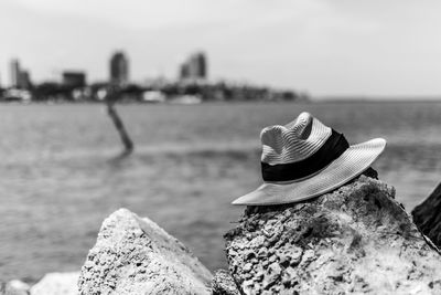 Close-up of rocks on beach against sky