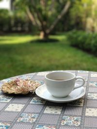 Close-up of coffee on table in lawn