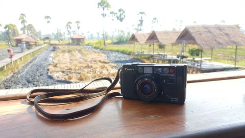 Close-up of camera on table