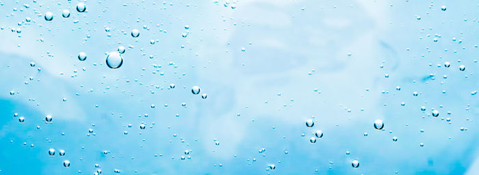 Full frame shot of raindrops on glass