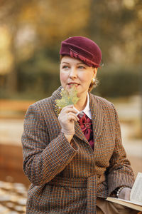 Portrait of young woman standing outdoors