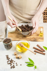 Midsection of woman preparing food on table