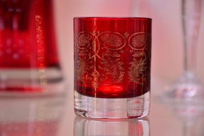 Close-up of red wine in glass on table