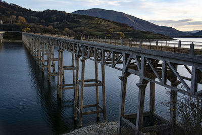 Bridge over river against sky