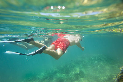 Man swimming in sea