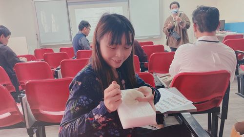 People sitting in front of building
