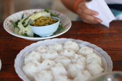 Midsection of person preparing food on table