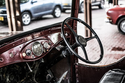 Close-up of vintage car on street