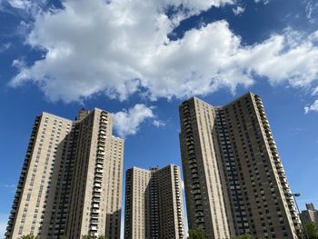 Low angle view of modern buildings against sky