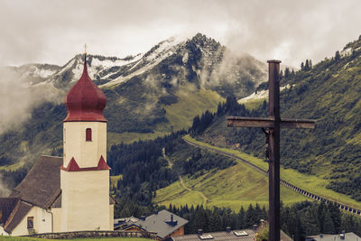 Panoramic view of building and mountains against sky