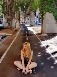 Young woman sitting outdoors