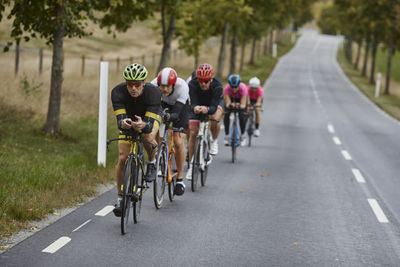 Male cyclists on country road