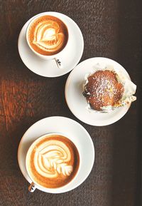 High angle view of cappuccino served on table