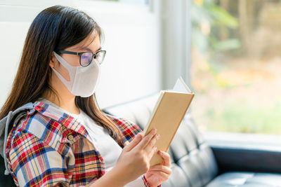 Portrait of woman using mobile phone