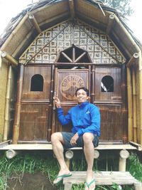 Portrait of a smiling man sitting outdoors