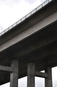 Low angle view of elevated road against sky