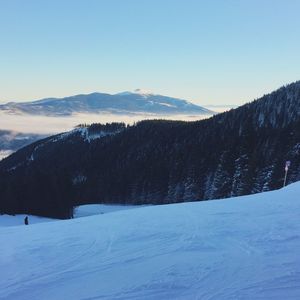 Scenic view of mountains against sky during winter