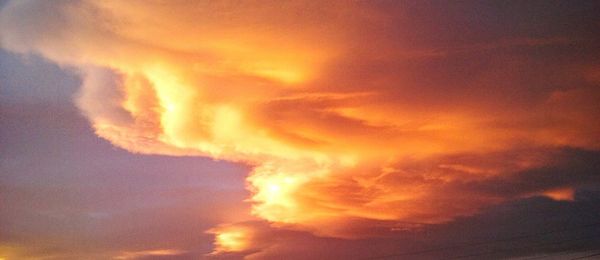 Low angle view of dramatic sky during sunset