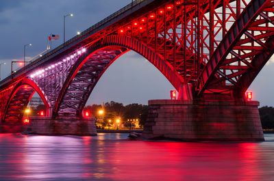 Low angle view of illuminated peace bridge at lake erie