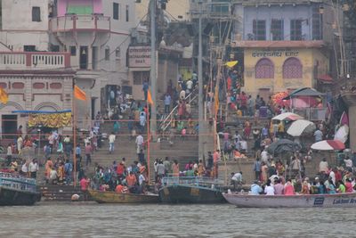 Group of people on boats in canal