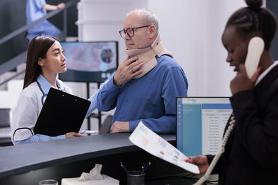 Business colleagues working in office