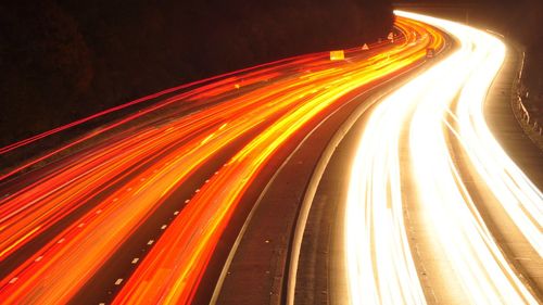 Light trails on road at night