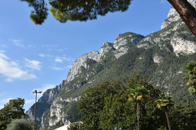 Low angle view of mountains against blue sky