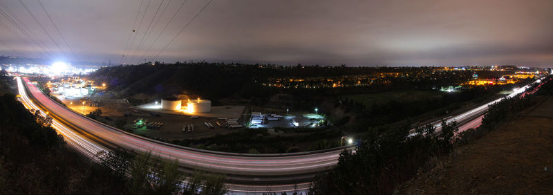 High angle view of light trails in city at night