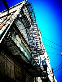 Low angle view of built structure against blue sky