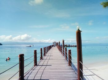 Pier over sea against sky